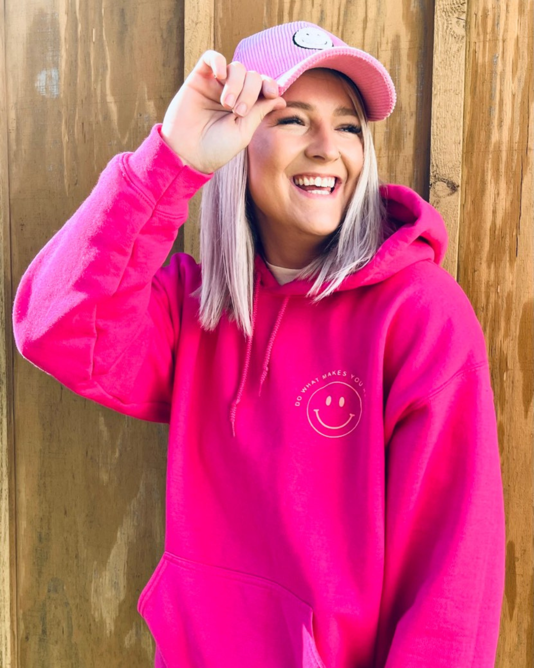 This Do What Makes You Happy Hoodie is the perfect way to brighten up your wardrobe. Crafted with a bright pink hoodie and cheerful orange design, it is sure to make you smile. The soft and comfortable fabric pairs well with biker shorts or your favorite jeans.