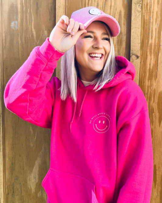 This Do What Makes You Happy Hoodie is the perfect way to brighten up your wardrobe. Crafted with a bright pink hoodie and cheerful orange design, it is sure to make you smile. The soft and comfortable fabric pairs well with biker shorts or your favorite jeans.